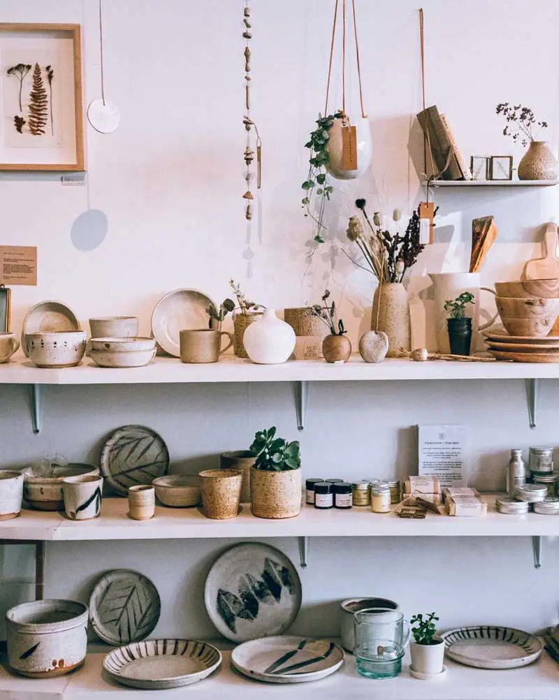 Shelves with ceramic plates, bowls, and vases